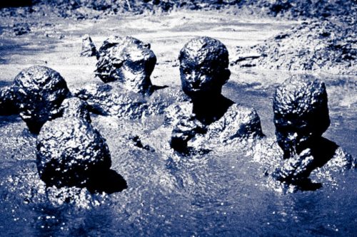 Editorial photo of kids in mud bath